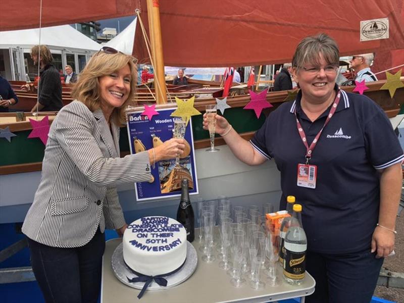 Barton Marine's Suzanne Blaustone toasts the Drascombe Lugger 50th Anniversary photo copyright Barton Marine taken at  and featuring the  class