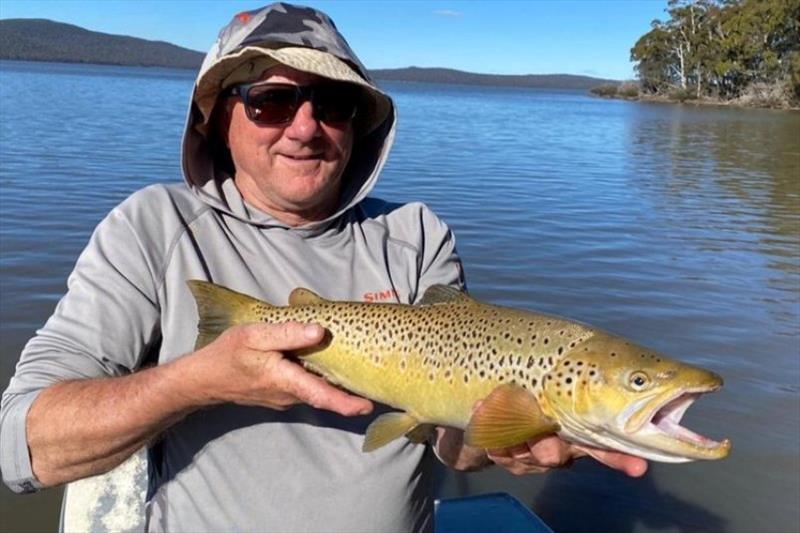 Alan Williams with a lovely Lake Sorell trout caught recently - photo © Spot On Fishing Hobart