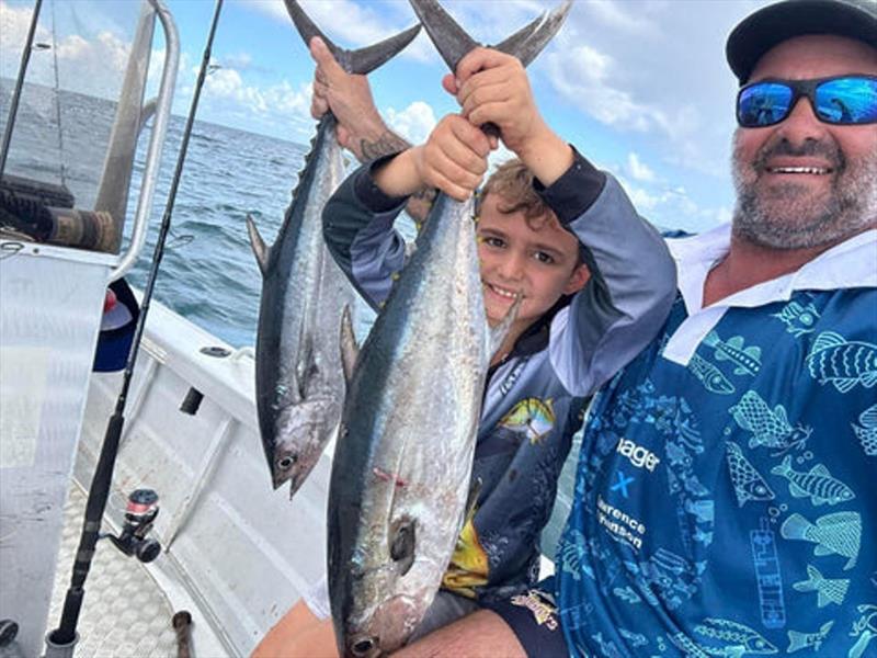 Keets and Joey with a brace of Hervey Bay longtails. Great fun for the family fisho - photo © Fisho's Tackle World