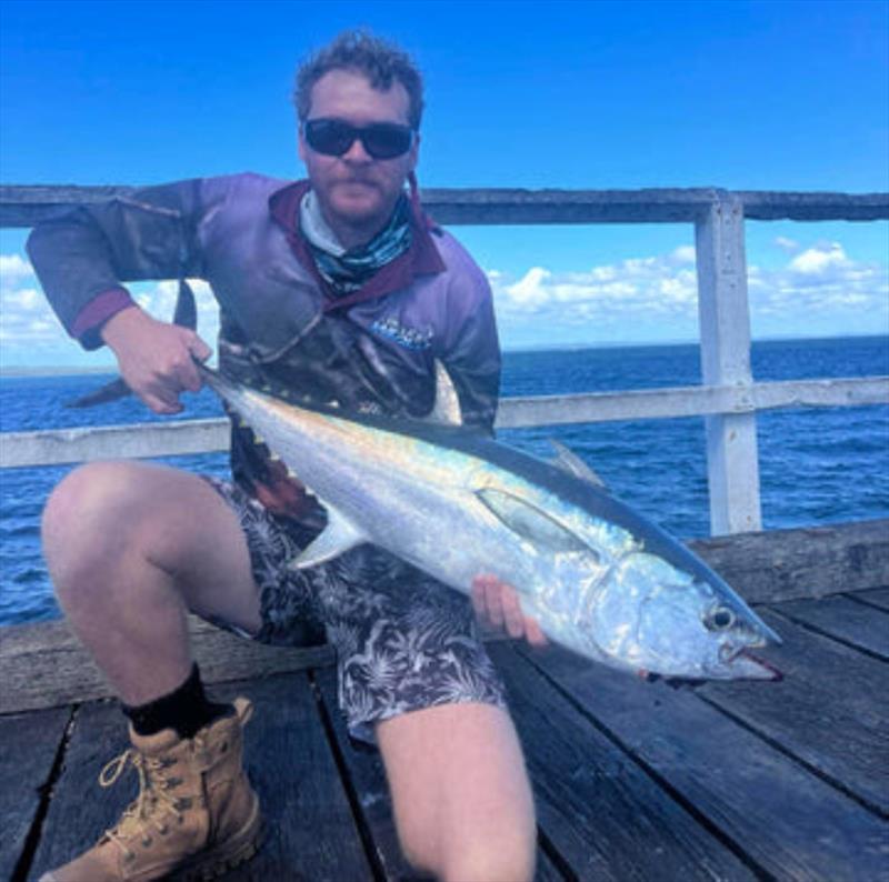 Kody Ezzy headed for the deep end of the Urangan Pier and caught this fine longtail tuna. It won't be the last tuna caught out there this week - photo © Fisho's Tackle World