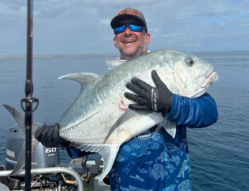 Fisho's Big Cat Reality Swains Trip 2024 - Joe Psaila having a cuddle with one of the GT he caught for the trip photo copyright Fisho's Tackle World taken at  and featuring the Fishing boat class