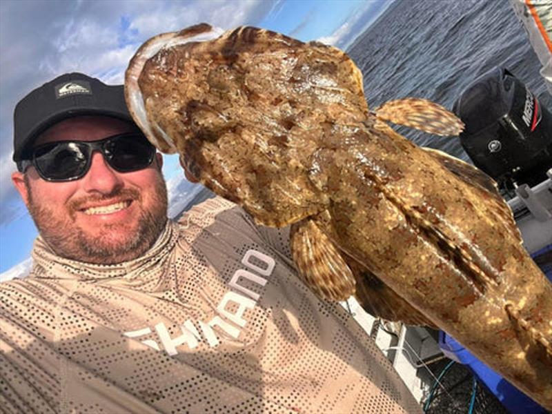 Stuart with one of the tastiest fish swimming, a fringe-eye flathead photo copyright Fisho's Tackle World taken at  and featuring the Fishing boat class