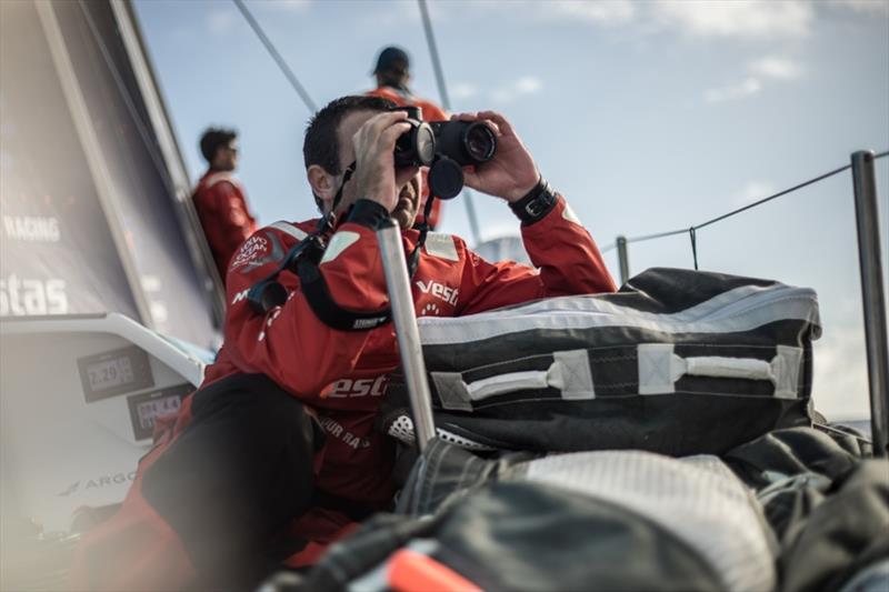 Volvo Ocean Race Leg 8 from Itajai to Newport, day 05, on board Vestas 11th Hour. Charlie Enright looks at the other red boat. - photo © Martin Keruzore / Volvo Ocean Race