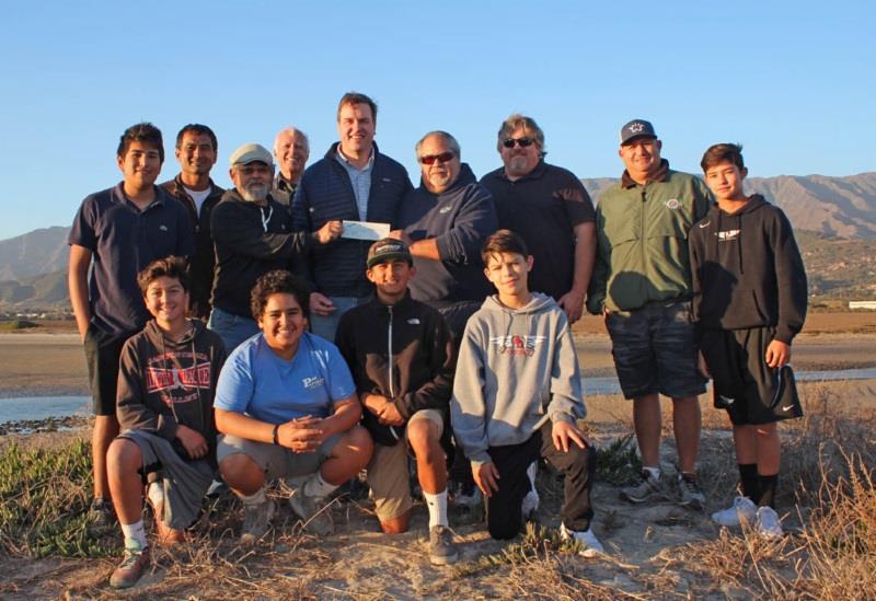 A group including representatives of local fishing clubs, The Sportfishing Conservancy and young fishermen from the Santa Barbara/Carpinteria area present Chet Work, Director of The Land Trust of Santa Barbara County photo copyright The Sportfishing Conservancy taken at  and featuring the Fishing boat class