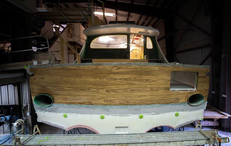 Of great focus for exterior carpentry crew is teak aft bulkhead and teak transom. We hand-select teak, and these projects are where rubber meets road: paying attention to details pays off. This is one of the prettiest transom boards we've ever installed. - photo © Bayliss Boatworks