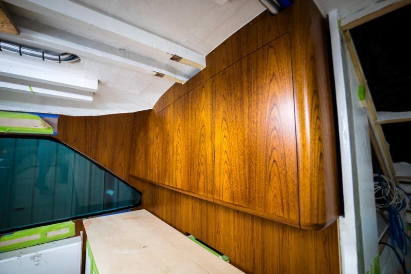 Detail on installed galley cabinets - photo © Bayliss Boatworks