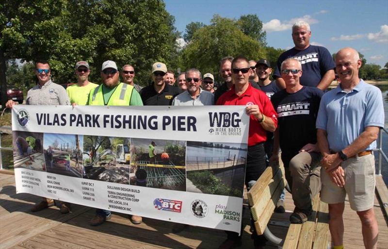 Union volunteers join together to celebrate the completion of the USA's Vilas Park Work Boots on the Ground fishing pier project, improving access to the lake for all photo copyright Union Sportsmen’s Alliance taken at  and featuring the Fishing boat class