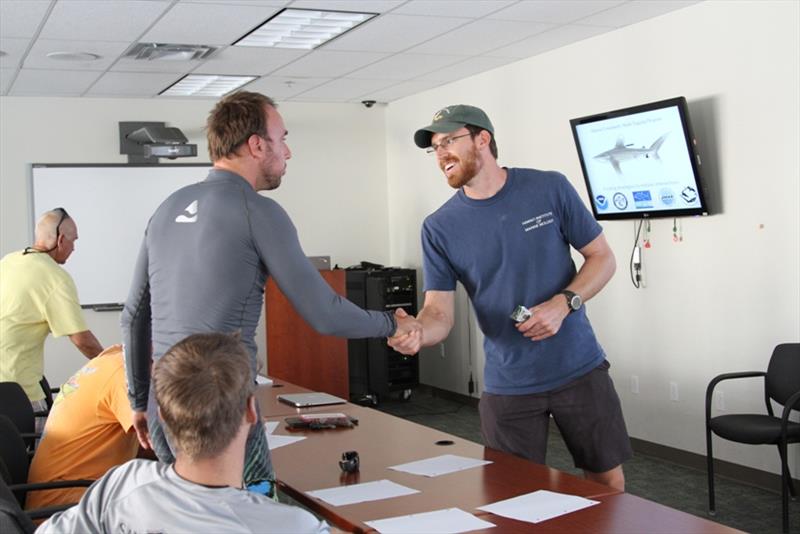 Mark Royer meets with a fisherman at the beginning of the shark tagging workshop in Kona - photo © NOAA Fisheries / Ali Bayless