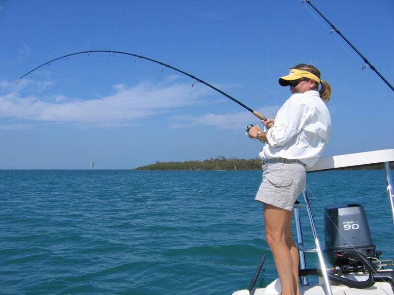 Woman fishing in Gulf of Mexico photo copyright Florida FWC taken at  and featuring the Fishing boat class