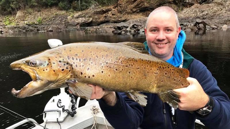 Shaun House with a West Coast Brown trout photo copyright Carl Hyland taken at  and featuring the Fishing boat class
