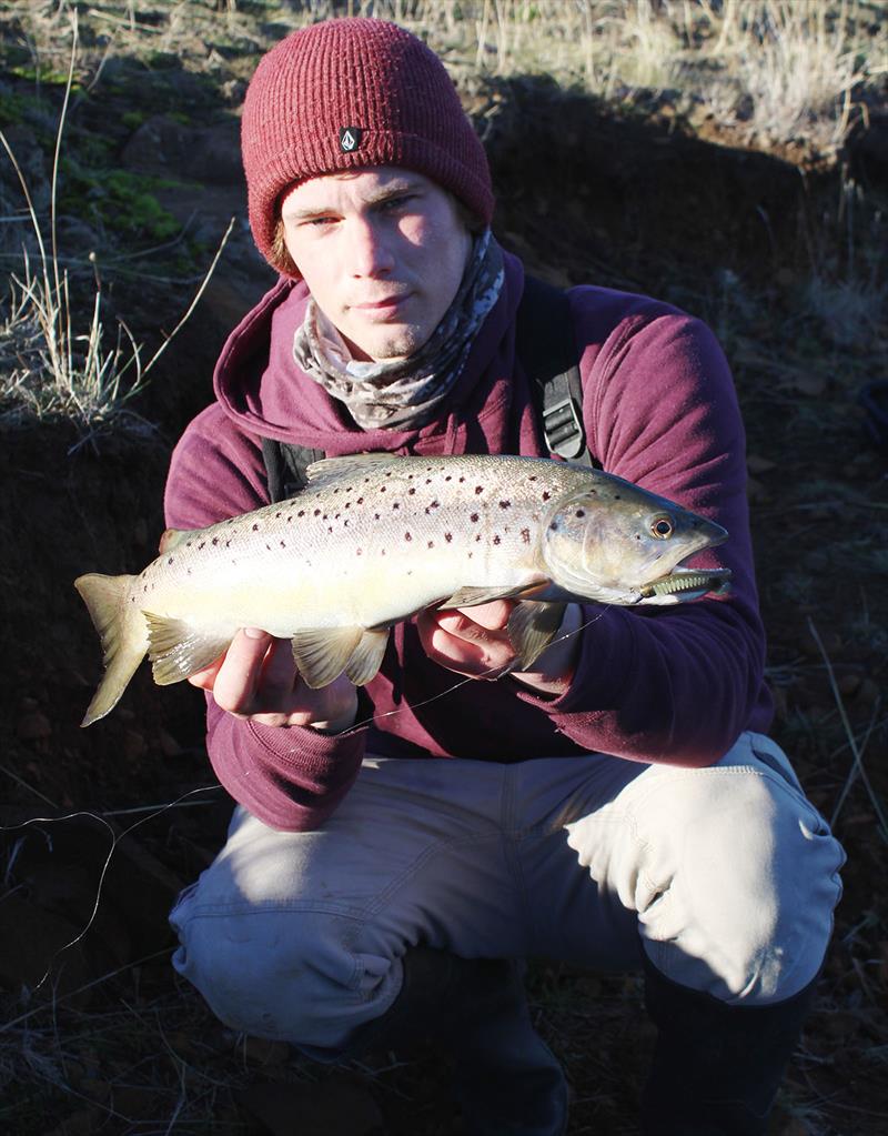 Will Mather with a Craigbourne brown trout photo copyright Carl Hyland taken at  and featuring the Fishing boat class