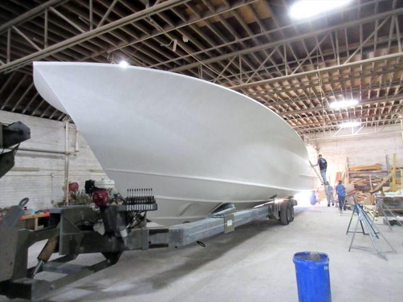 Hull 65 is flipped right side up and loaded on a trailer to return to her construction building - Hull 65 - 64' Custom Sportfish photo copyright Jarrett Bay Boatworks taken at  and featuring the Fishing boat class