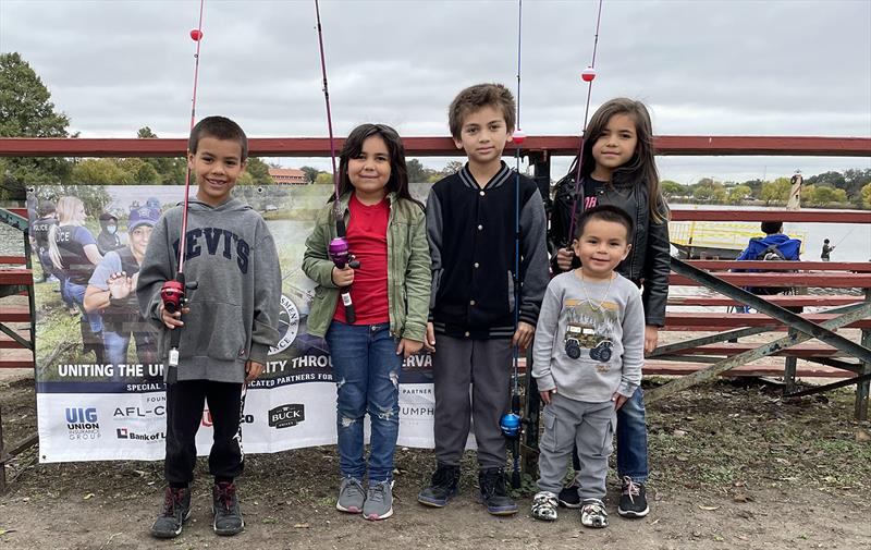 Many youths who attended the USA's ‘Fishing Lines at Christmas Time' event had never fished before. They received hands-on instruction from union volunteers and went home with a new fishing rod and reel - photo © Union Sportsmen’s Alliance
