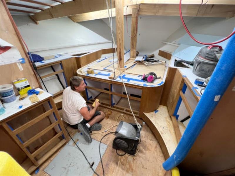 Hull #9 - Clarke prepping master joinery - photo © Michael Rybovich & Sons