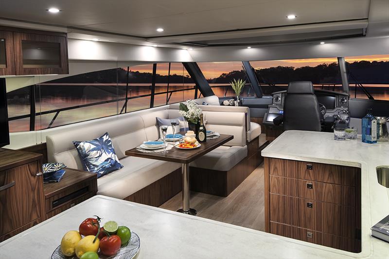 Stylish saloon and gourmet galley of the Riviera 5400 Sport Yacht photo copyright Riviera Australia taken at  and featuring the Marine Industry class