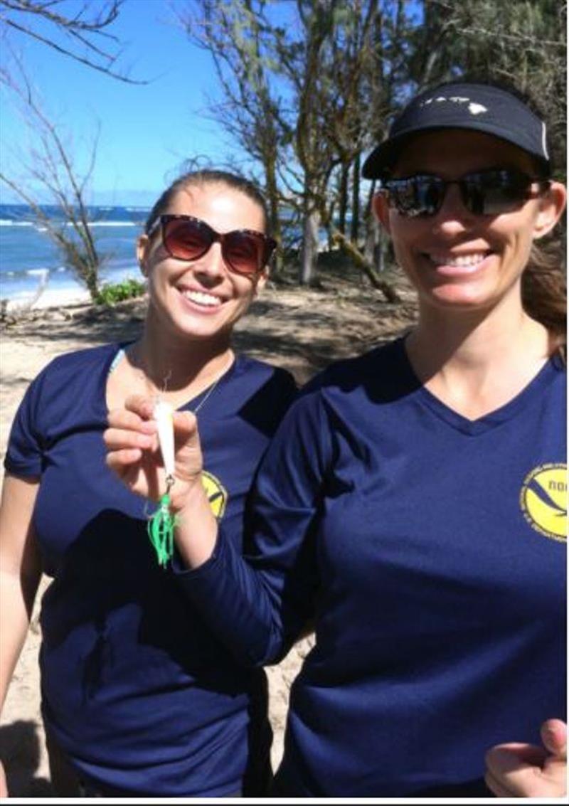 Members of the NOAA team show off the lure removed from Kaimana photo copyright NOAA Fisheries taken at 