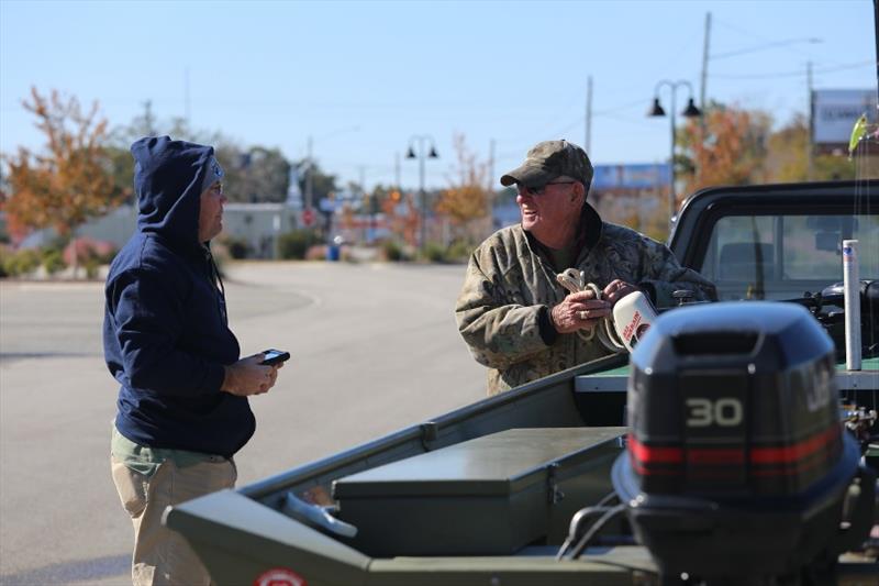 A field interviewer surveys an angler in Jacksonville, North Carolina. From Maine through Georgia, interviewers use tablets to record and send data. - photo © NOAA Fisheries