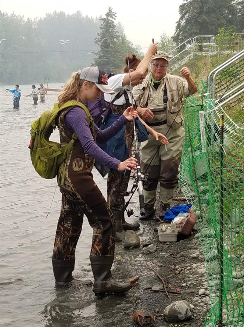 Stream Watch ambassadors help local anglers properly rig fishing gear on Kenai River near Soldotna, Alaska photo copyright Kenai Watershed Forum taken at 