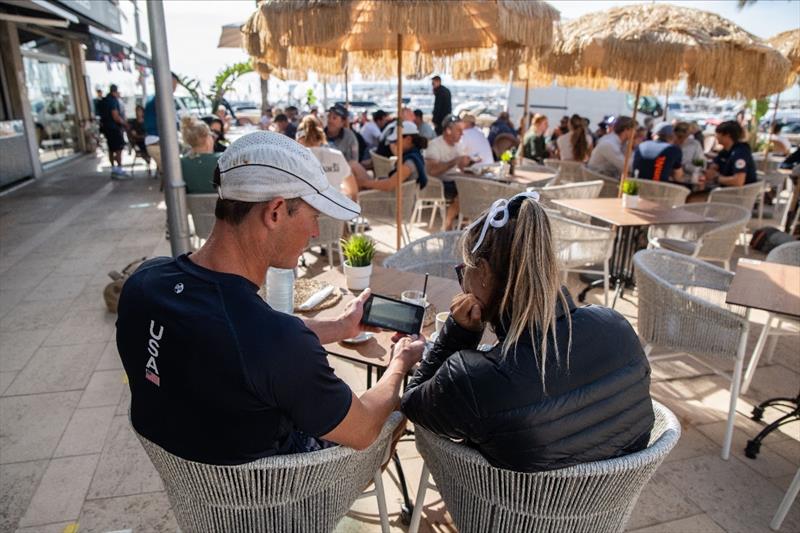 During a wind delay, Paris 2024 Nominated ILCA 6 Athlete Erika Reineke and USST ILCA 6 Coach Erik Bowers review footage of Erika's downwind legs from the Trofeo Princesa Sofía photo copyright US Sailing Team taken at Real Club Náutico de Palma