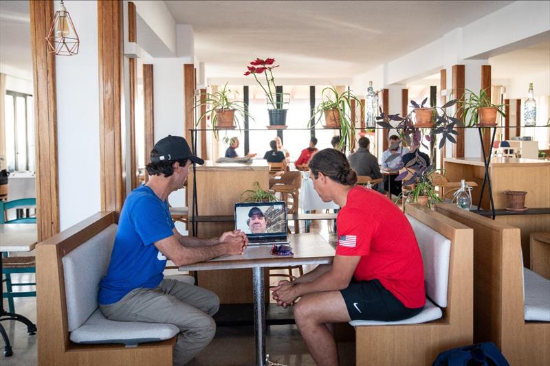 Noah Lyons (USST Men's iQFOiL Athlete) and Juanma Moreno (USST Men's iQFOiL Coach) meet remotely with Dave Perry (USST Rules Expert) photo copyright US Sailing Team taken at Real Club Náutico de Palma