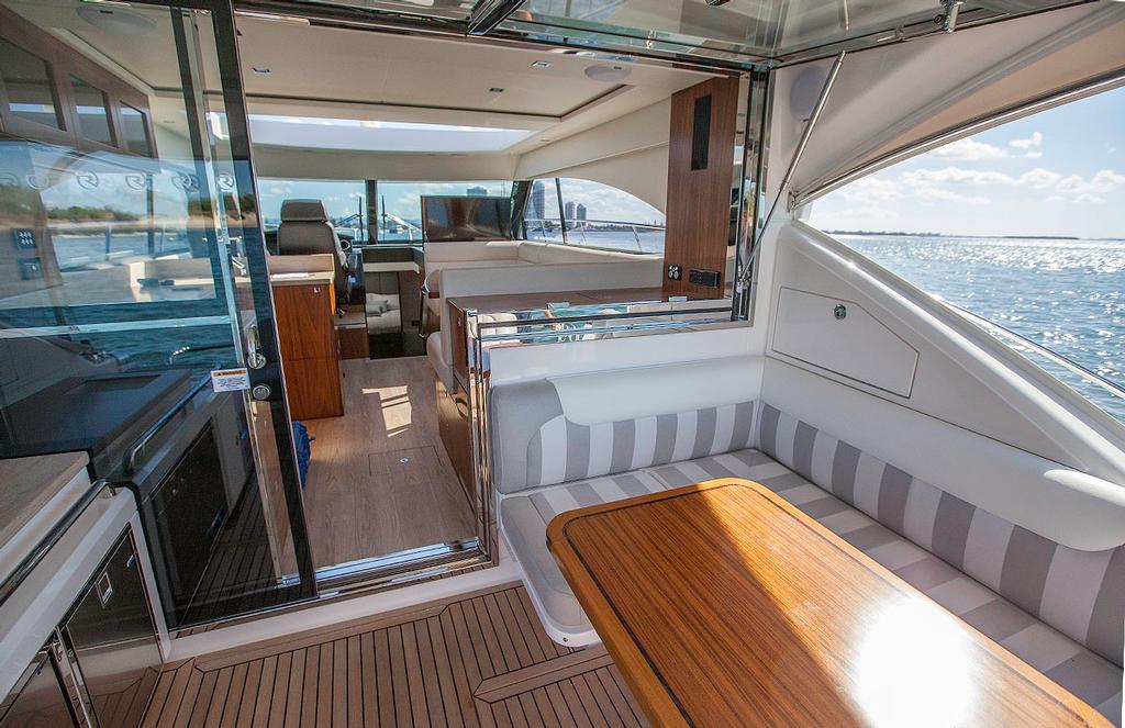 Terrific al fresco dining is a benefit of one-level boating like this. - Riviera 4800 Sport Yacht ©  John Curnow