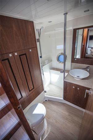 Day or second head has the washer/dryer in behind the locker on the left. - Riviera 4800 Sport Yacht photo copyright  John Curnow taken at  and featuring the  class