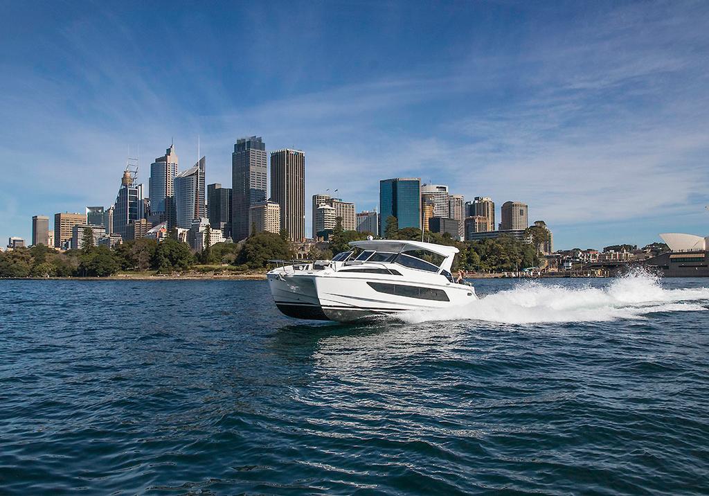 The Great Entertainer is quick to get up and go as she flies along in front of Sydney's CBD. - Aquila 36 ©  John Curnow