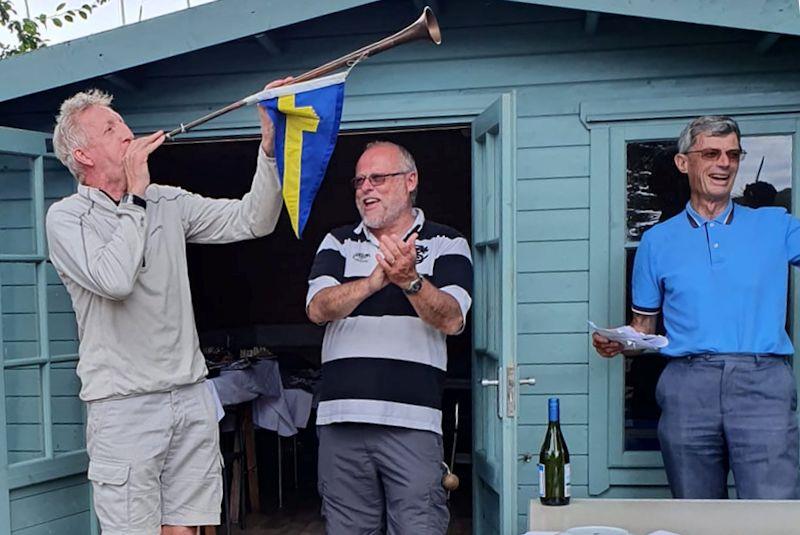 Guy Mayger wins the Selden Solo open meeting at Portchester, and blows the horn in triumph photo copyright PSC taken at Portchester Sailing Club and featuring the Solo class